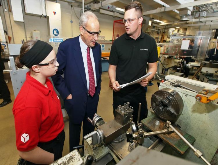 Lord Sainsbury with apprentices, Katherine Ellett (DPDUK) and Dean Robinson (London Midland)