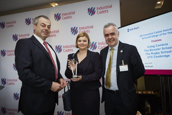 Vicky Barwis and Nick Tyson from Coleg Cambria receive the Award from Colin Smith CBE, Group President Rolls-Royce