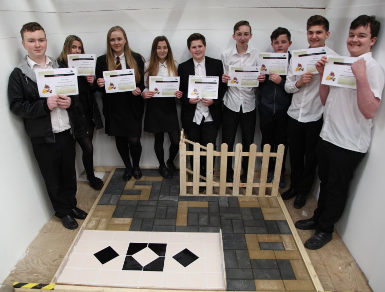 teams from Ysgol Plasmawr and St Richard Gwyn Catholic High School with their winners’ certificates and taking part in the challenge tasks