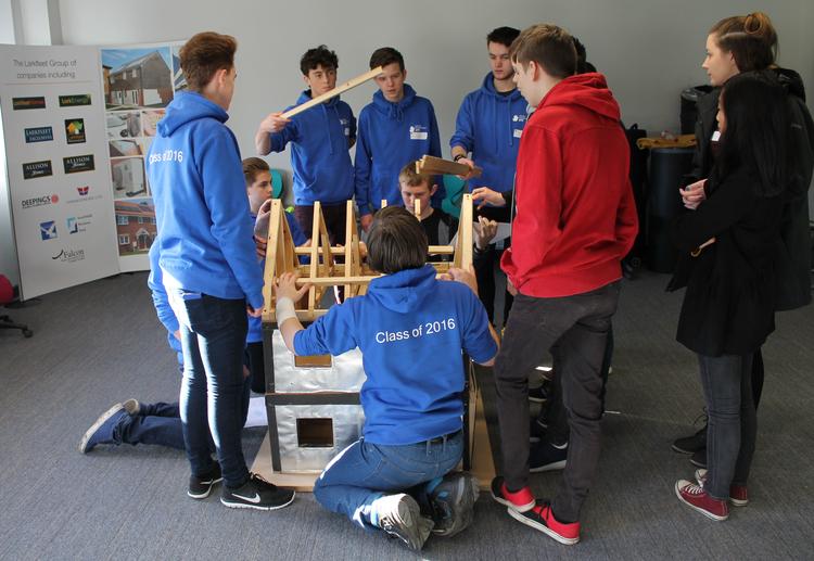 Students at GPUTC working with the model house donated by the Larkfleet Group of Companies.