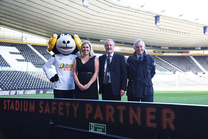 Left to right – Rammie, Jennie Bowmer, MD Mitre Group, Nigel Wood, Safety & Operations Manager, Derby County Football Club, Danny Maxwell, Programme manager, Mitre Group.