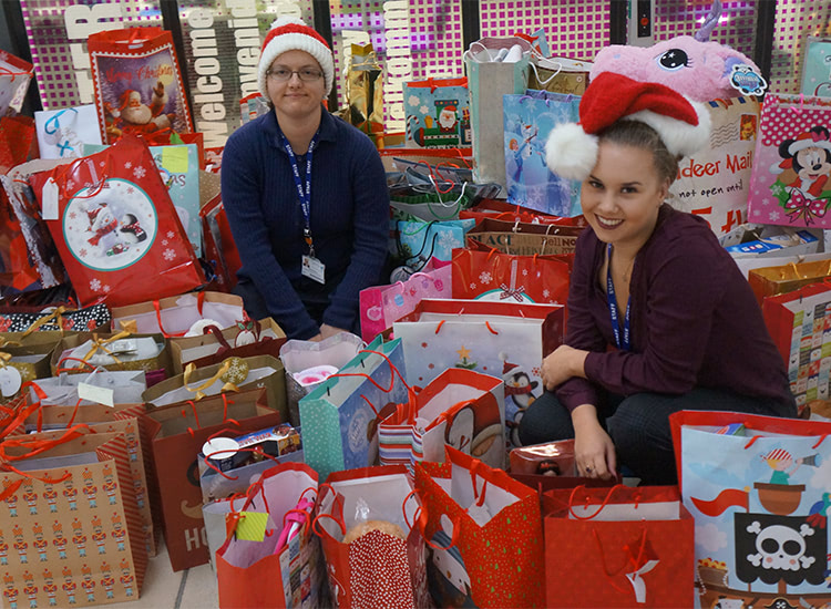 Pictured Sarah Paterson and Shannen Chappell from CRC’s employer engagement department with the children’s Christmas gifts