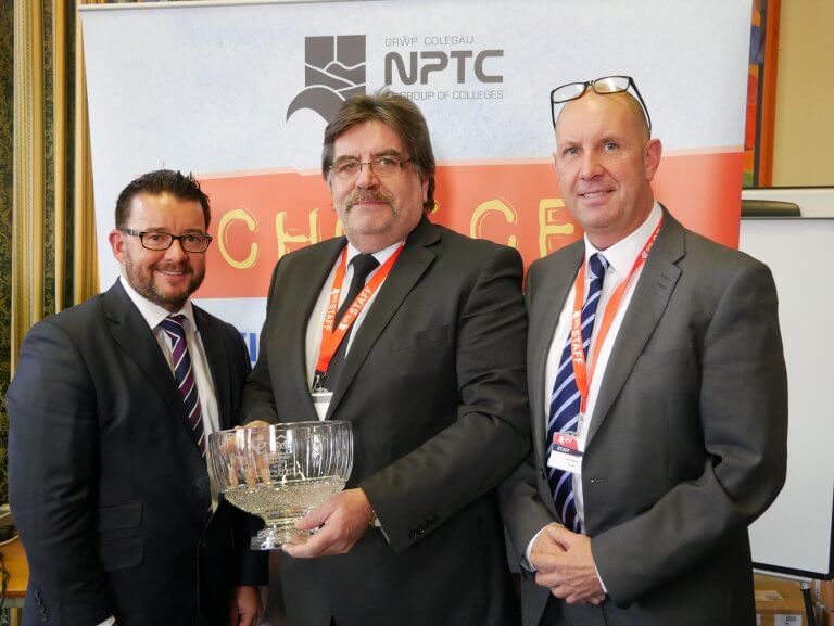 Sharing Success: Anthony Thomas, Managing Director of ASW Property Services Ltd and Cyfle Board member presents a copy of the Queen’s Award to Mark Dacey, CEO of NPTC Group of Colleges and Ian Lumsdaine, Director of Studies.