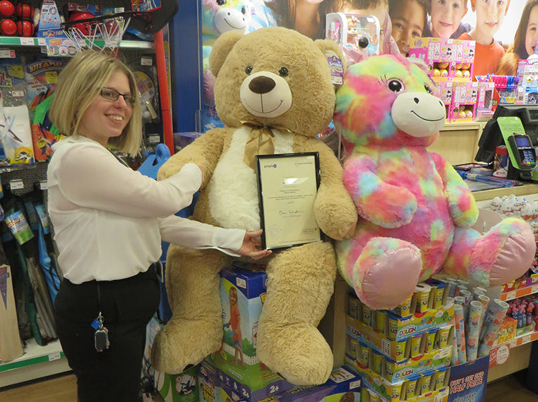 Gina Loombe, pictured with her award