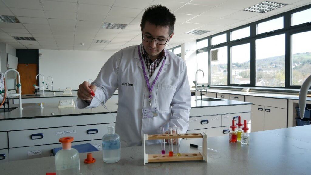 Jarrod mixing up solutions in the science laboratory