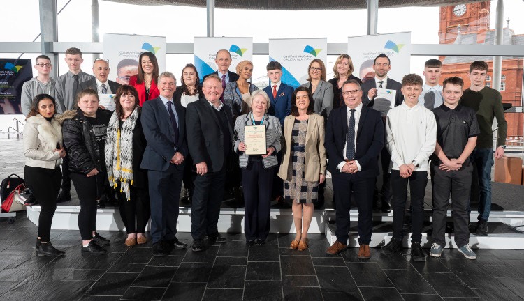 the CAVC Junior Apprentices and CAVC staff plus local school representatives with front row, l-r: AoC Regional Director for the South West Ian Munro, CAVC Chief Executive Mike James, CAVC Principal Kay Martin, Minister for Welsh Language and Lifelong Learning Eluned Morgan and Skills and Education Group Chief Executive Paul Eeles