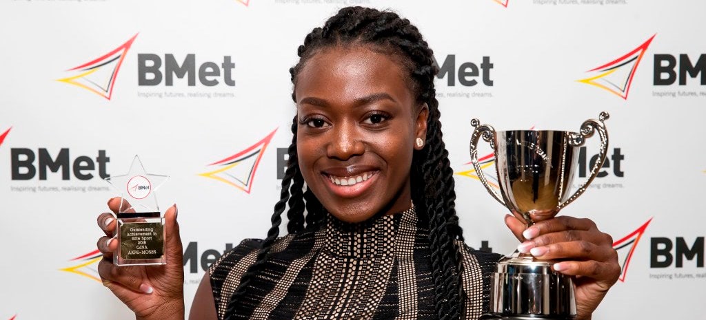 Gina Akpe Moses receiving the top trophy at BMet’s Sports Awards