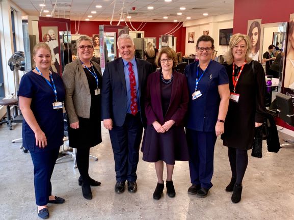 members of The City of Liverpool College Hair & Beauty team with Helen Farrow, Alan Woods, Dame Louise Ellman,and Kate Rolf. Photo Credit: Agent Marketing