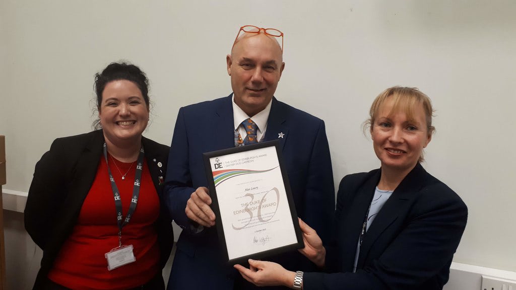 Alan Lowry with Coleg Cambria Principal, Sue Price, and Katrina Long, Operations Officer at the DofE