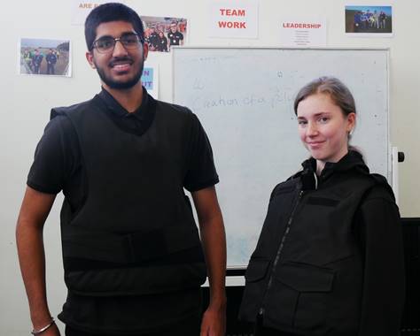 Public Services students Paul Atwal, 16 from Ilford and Jessica Banks 17 from Dagenham try on the donated bulletproof vests