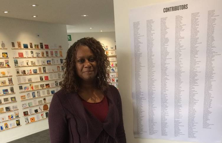 Barking & Dagenham College’s Principal and CEO Yvonne Kelly looked at the RCA's Secret postcards, one of which was created by lecturer David Bennett