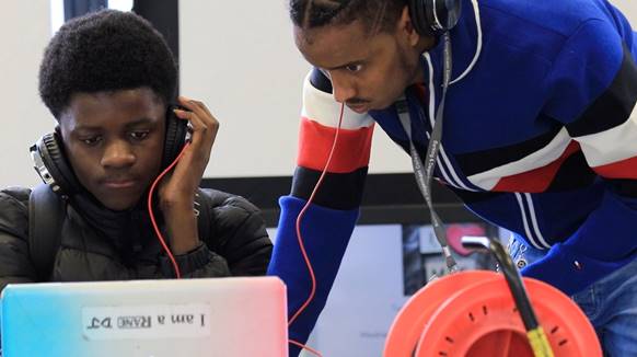 16 year old Junior Ndjaka with his Tutor Teddy Nur taking part in the Barbican Box project that involved him producing an original work