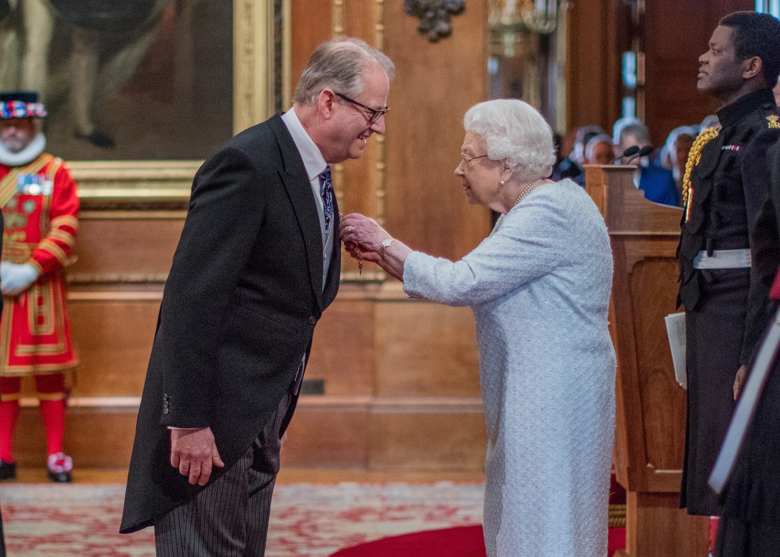 Nigel Duncan, Fareham College Principal being given his OBE by Her Majesty the Queen