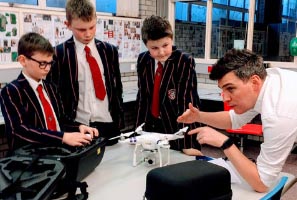 Students from Coleraine Grammar School in Northern Ireland, UK learn how to fly a drone with Alan Hook, Associate Head of School (Media) at Ulster University, Coleraine.