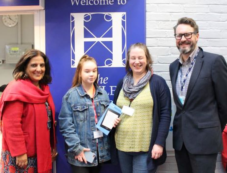 Zoe and her daughter Sophie are pictured with the Principal of The Henley College, Satwant Deol and Head of Faculty, Tristan Arnison accepting her prize.