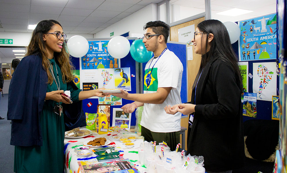 West London College Travel & Tourism students showcase South American tourist destinations, food and culture to visitors at the International Village Fair.