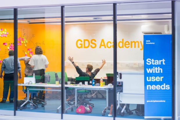 Photo of the GDS Academy classroom and person celebrating