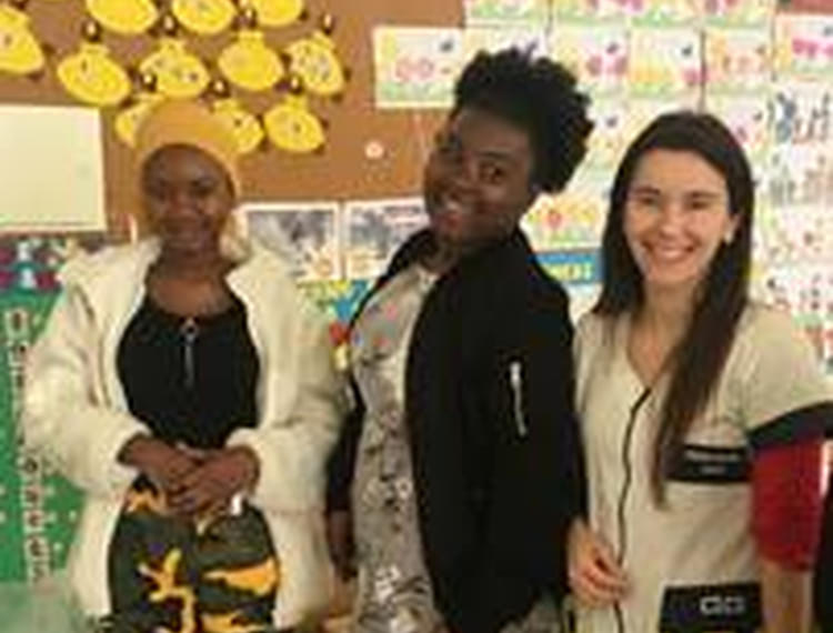 left to right – Students Salamatu Muftahu and Akua Frimpomah with a member of staff at the day centre