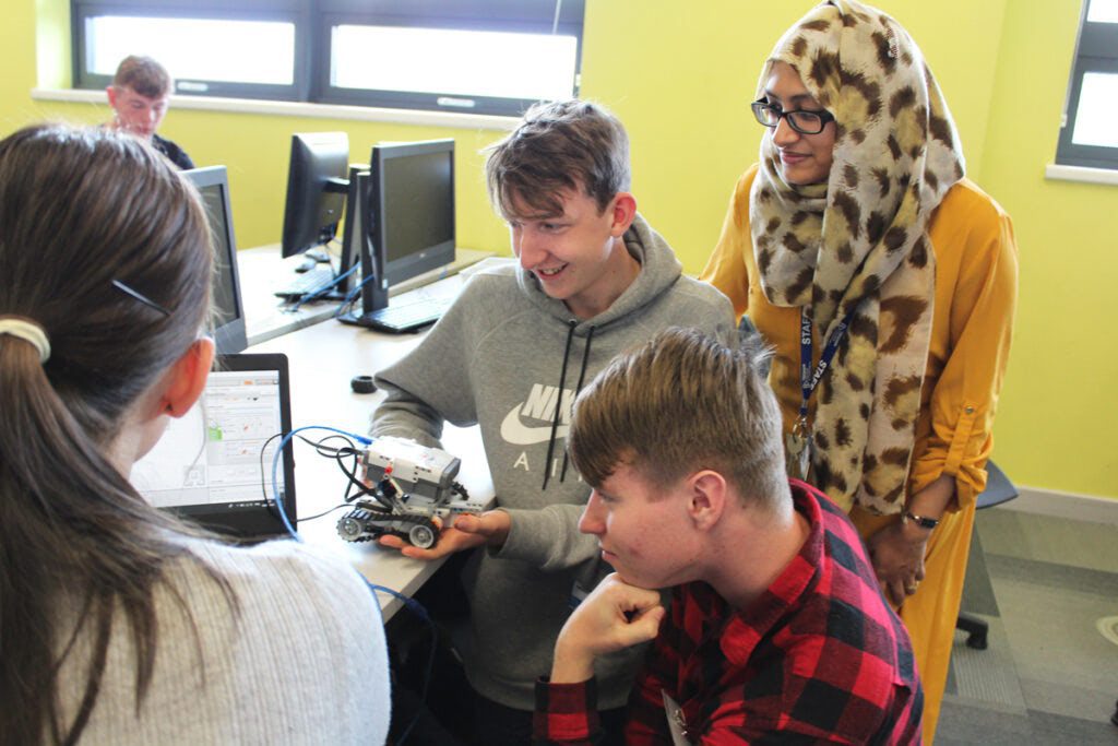Students working on a robotic Mars lander with Tresham College Computing Course Manager Wafiqah Lahaware