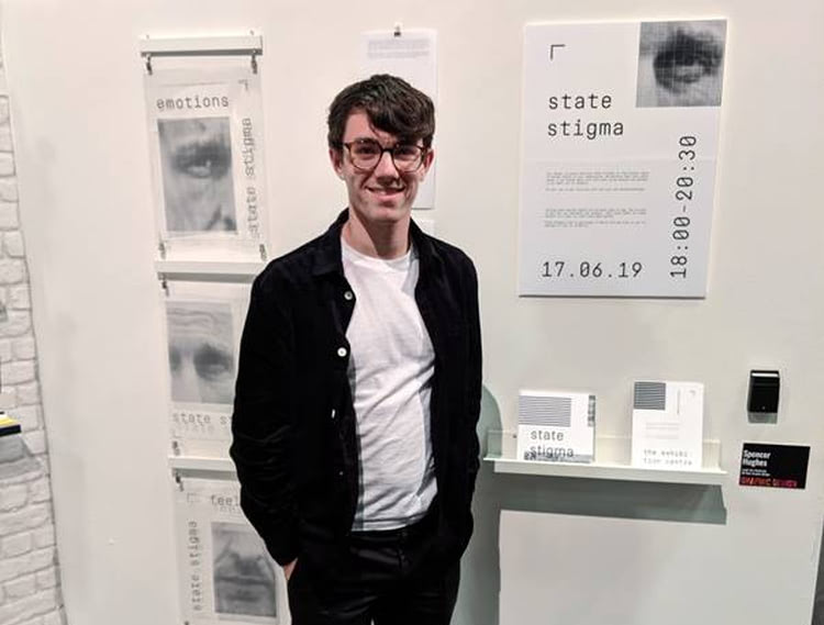 Spencer Hughes with his graphic work at the Barnsley College Art, Design and Fashion End of Year Show.