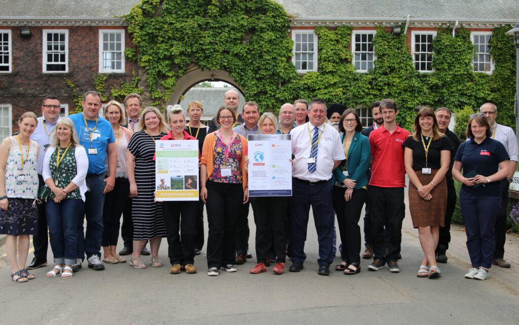 Staff at WCG receive their 5-year Planet Mark certificate from Sarah Gillett (centre), operations director for The Planet Mark