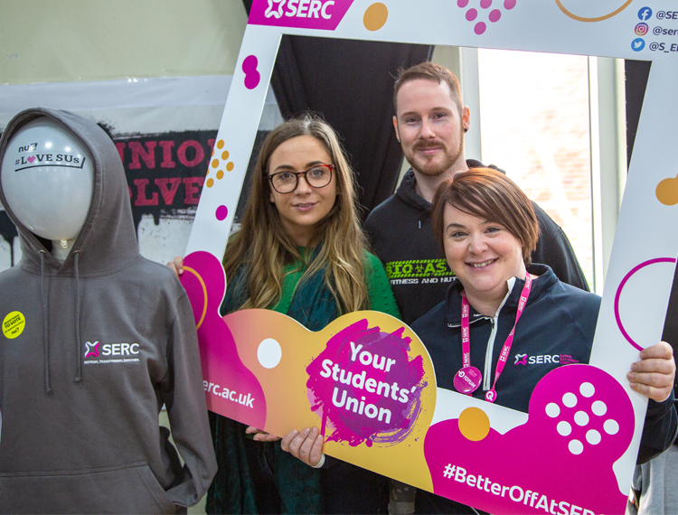 Caption: Freshers’ Week at SERC Bangor Campus had great support with almost 20 exhibitors joining (L – R) Nora Duncan Senior Campaigns and Development Advisor at NUS-USI, Alex Fox, Level 3 Media student and Catherine Shipman, Student Engagement Manager, SERC, to welcome hundreds of new students to the College.