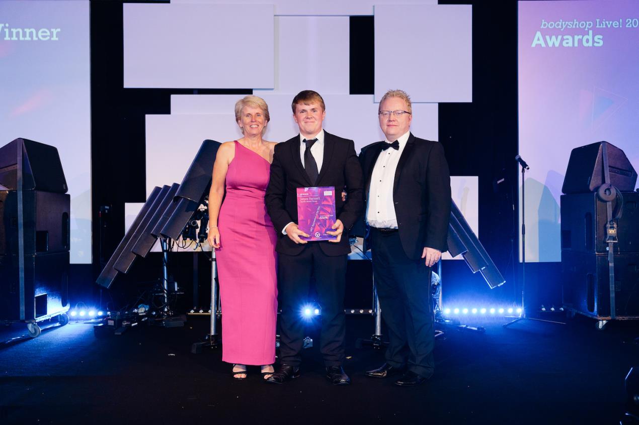 From LtoR: Sue Pittock, Remit CEO, presents James Barnard with his award, accompanied by Chris McKie, Vision MD