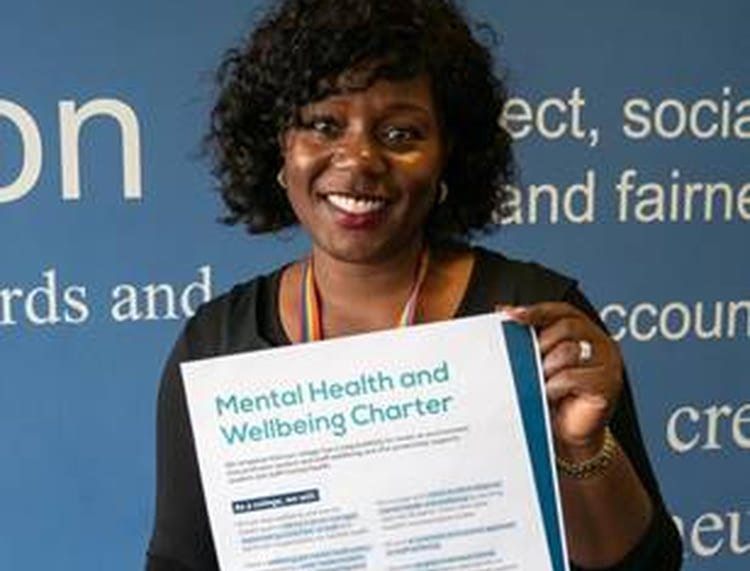 Janet Curtis-Broni, Executive Director - People and Organisational Development who signed the new national mental health and wellbeing charter on World Mental Health Day