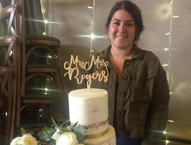 SERC student and entrepreneur, Keely Sherry, from Lisburn, proudly poses with her first wedding cake created at her new business venture SoBake.