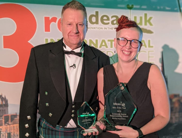 CACHE Alumni Editor, Dawn Mulvaney, accepts the awards on behalf of NCFE at the ideasUK conference.
