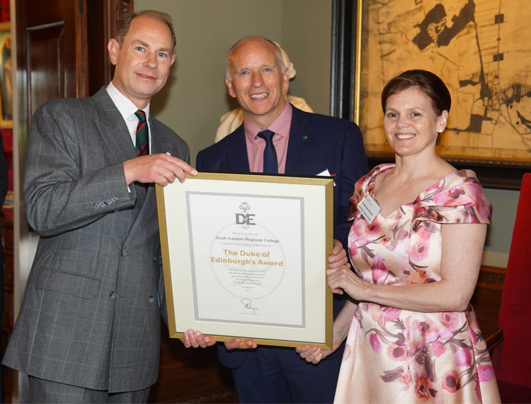 HRH Prince Edward, The Earl of Wessex, presents South Eastern Regional College’s John Nixon and Michelle Hickland, with the Duke of Edinburgh Award Operating Licence at Hillsborough Castle.