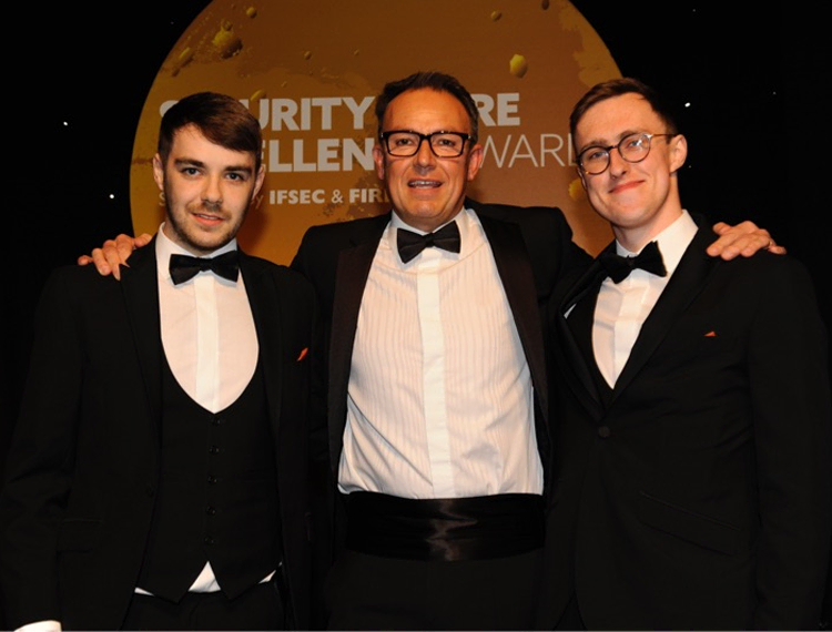 South Eastern Regional College (SERC) Fire and Security Apprentices Scott McNab (L) and Adam Smylie (R) celebrate winning in the Engineers of Tomorrow Intruders category at the Security and Fire Excellence Awards 2019 with Simon Banks, CSL Founder.