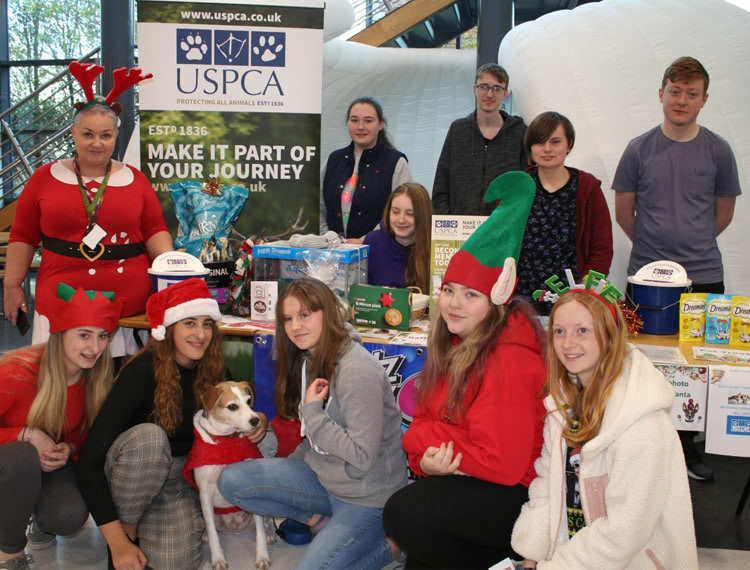 SERC Students offer Festive Tips for Pet Safety:(Back) Lecturer, Christine Costello and students Kerry Davidson, Niall McComb, Zoe Spence, Dylan Armstrong, (Front) Aimee Brown, Atlanta Doyle, Bobby the Dog aka “Santa Paws”, Rebecca Dobinson, Tamzin Spence, Shannon Hastings share top tips on pet safety at Christmas and raise money for USPCA during the College’s Festive Fairs.