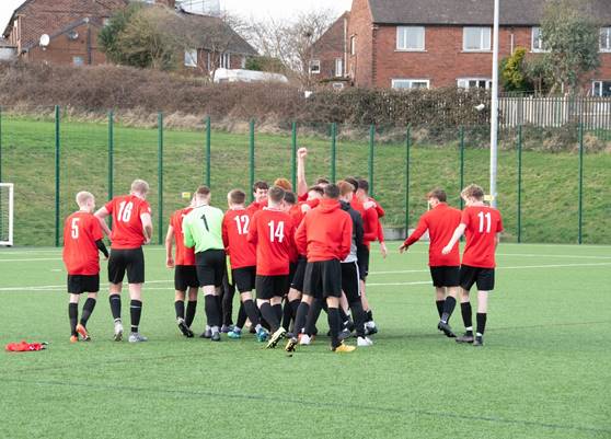 Barnsley College footballers celebrate being crowned champions.