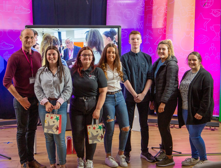 Pictured earlier this year at SERC’s Project Based Learning Enterprise Finals are (l-r) guest judge Stephen Addy, Head of Regulatory Services, Ards and North Down Borough Council with Level 3 Health and Social care students Alexis Rooney, Nicola Hanna, Mia Angell, Conan Lennon, Catherine Hickey and Aislinn Armstrong from the Downpatrick Campus who scooped the environment award for their enterprise Golden Memories activity group for older people.