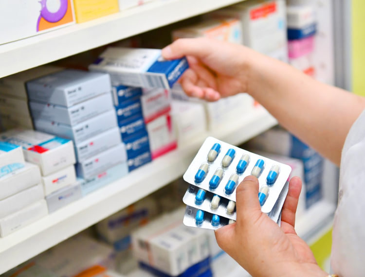 Pharmacy - collecting tablets off a shelf