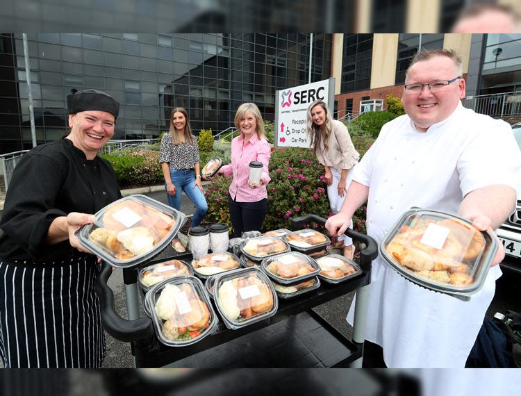 SERC Downpatrick Campus Raey Price, Catering Technician, Megan Rollins, Innovation Advisor, Heather McKee, Director of Strategic Planning, Quality and Support, Dearbhla Knight, Innovation Advisor and Thomas Turley Hospitality and Catering Lecturer display some of the baked goods and freshly cooked and chilled food meals ready for distribution for people in the local community.