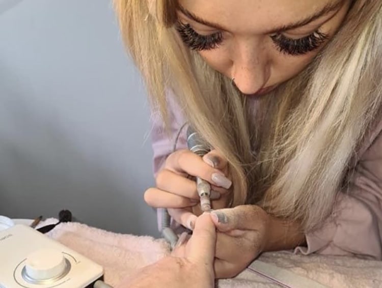 Photograph: Ella White creating bespoke nails for a client.