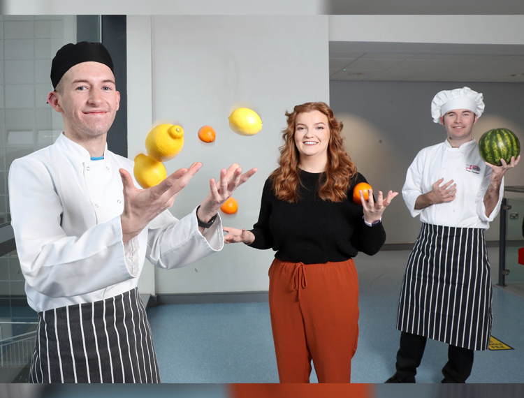 Dish of the Day: NVQ Level 3 Professional Cookery students Ryan Russell (Downpatrick) and Aaron Casement (Downpatrick) with Anna Leahy (Saintfield) centre, from SERC Intern Academy, get set for a delicious delivery as part of SERC’s Healthy Eating Week.