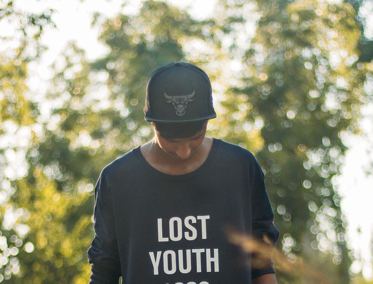 Young man with a lost youth T-shirt