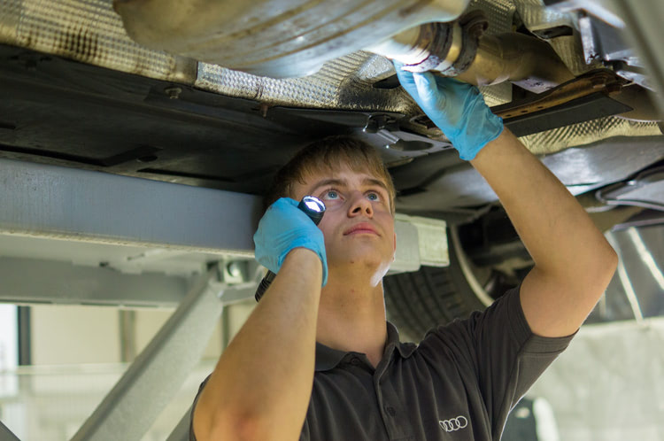 Mechanic inspecting a car