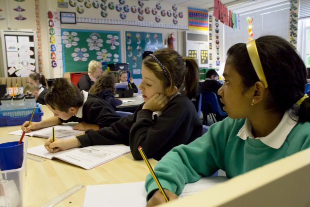 pupils sat at desks in a classroom