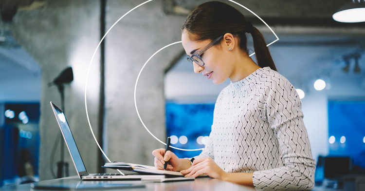 young female professional at a desk and laptop