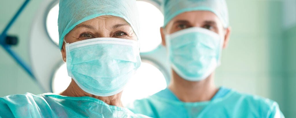 Two medical professionals in masks
