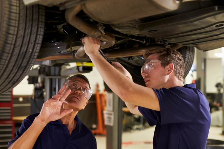 Mechanic inspecting a car