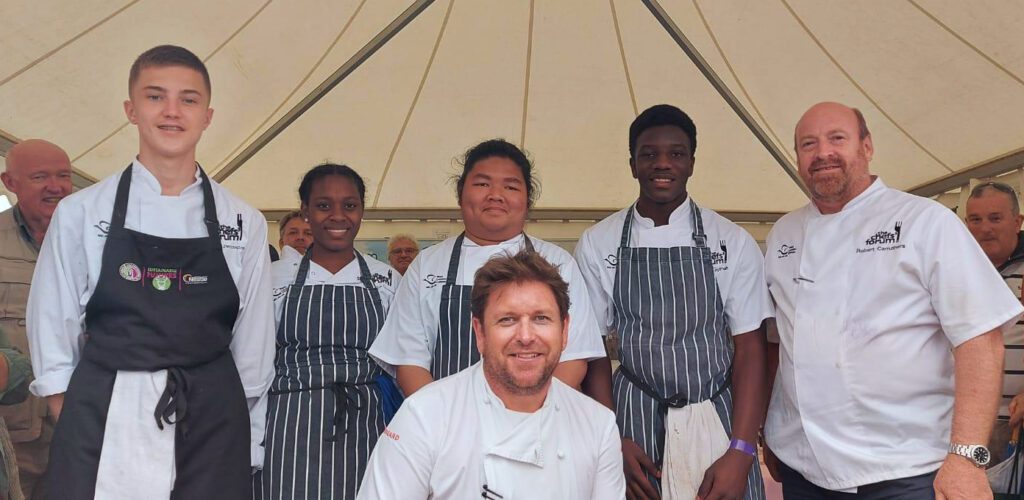 Caption: Celebrity Chef James Martin with l-r: Freddie Pennington, Keelorna Charles, Nick Custodio, Jason Gyimah and Lecturer Bob Carruthers
