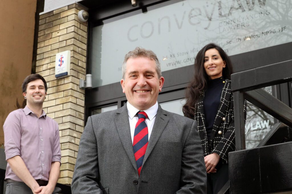 Convey Law’s managing director Lloyd Davies with apprenticeship tutor Sophia Ramzan and apprentice Sean McCarthy.