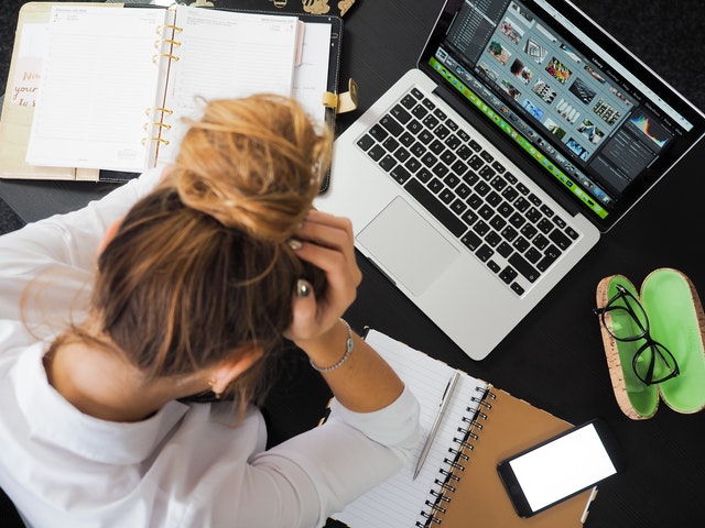 stressed woman at laptop