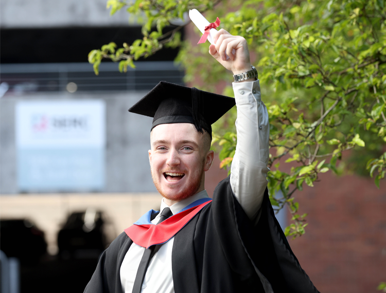 Ryan McKeown, from Lisburn, celebrates his HND in Computing, one of hundreds of students who graduated from SERC this year.