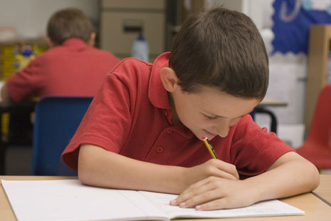 Pupil working in classroom